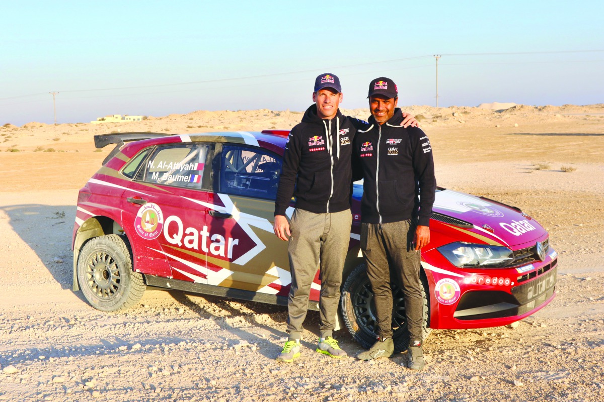 Qatar’s Nasser Saleh Al Attiyah and his French co-driver Matthieu Baumel pose for a photograph after a test run yesterday.