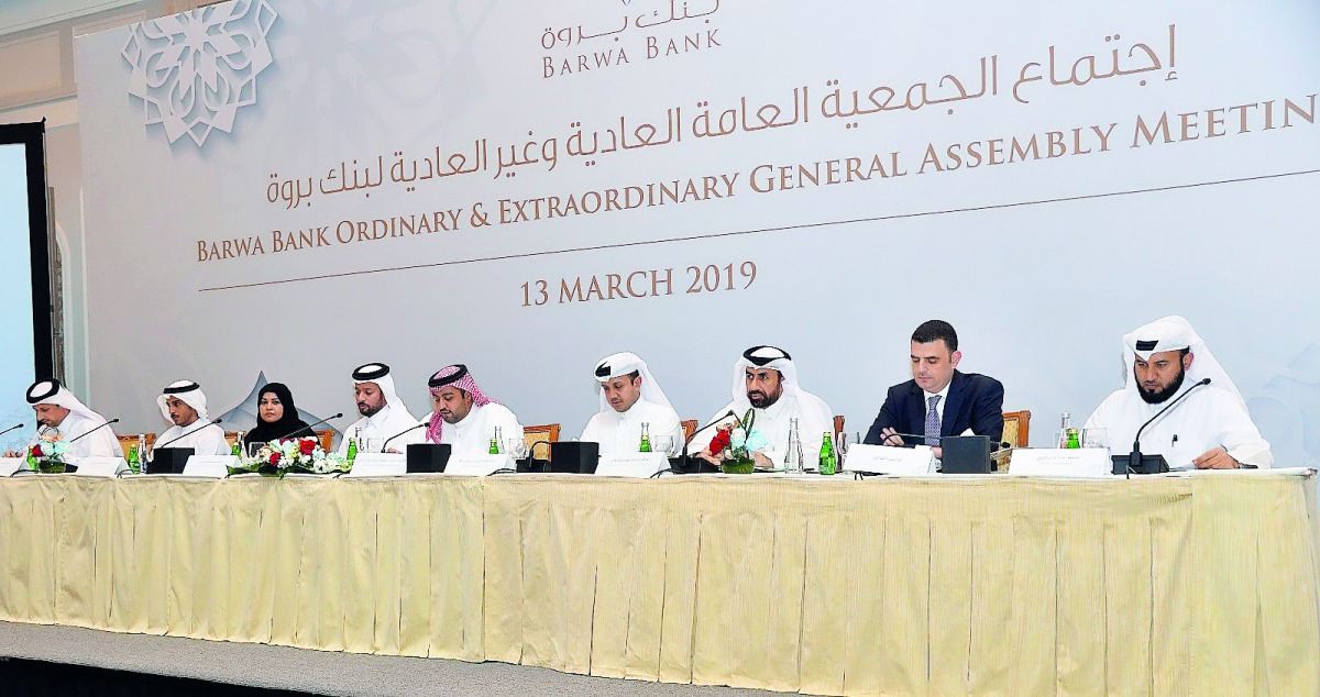 Sheikh Mohamed bin Hamad bin Jassim Al Thani, Chairman of the Board and Managing Director of Barwa Bank, and other board members at the AGM, yesterday. 