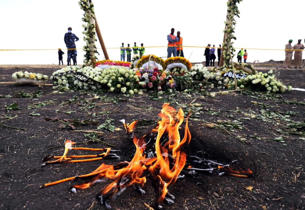 Candle flames burn during a commemoration ceremony for the victims at the scene of the Ethiopian Airlines Flight ET 302 plane crash, near the town Bishoftu, near Addis Ababa, Ethiopia March 14, 2019. Reuters/Tiksa Negeri 
