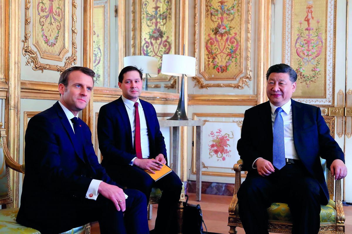 French President Emmanuel Macron (L) meets with Chinese President Xi Jinping (R) at the Elysee Palace in Paris, on March 25, 2019. AFP/pool/Gonzalo Fuentes