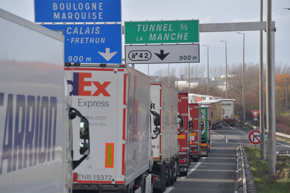 Trucks on the A16 highway between Dunkerque and Calais due to extensive controls by the customs officers protesting against the lack of staff and material ahead of the Brexit on March 4, 2019. AFP/ Philippe Huguen