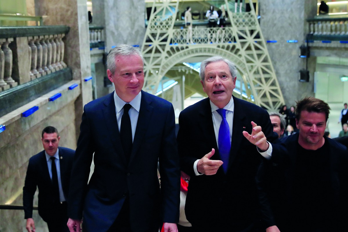 French Finance and Economy Minister Bruno Le Maire and Galeries Lafayette group Executive Chairman Philippe Houze visit the new Galeries Lafayette flaghip store on the Champs Elysees avenue in Paris, March 26, 2019. Reuters/Gonzalo Fuentes 