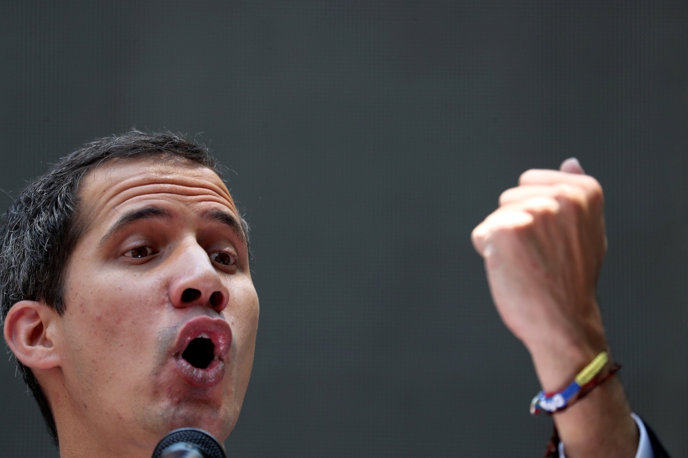 Venezuelan opposition leader Juan Guaido, who many nations have recognised as the country's rightful interim ruler, gestures as he speaks during a meeting with political leaders in Caracas, March 27, 2019. Reuters/Ivan Alvarado  