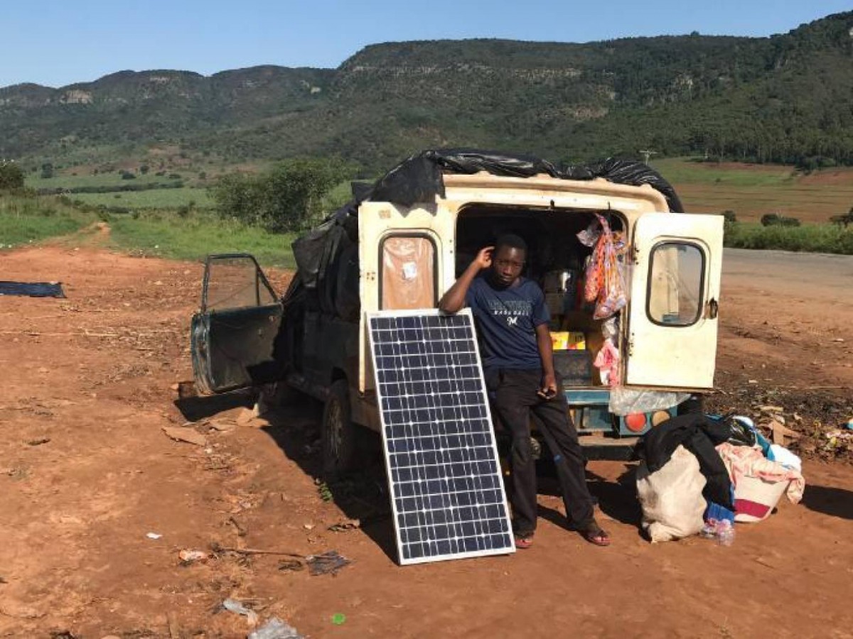After losing his shop and his home to recent floods, Amos Myambo and his family are living in a van on a roadside outside Chipinge town, Zimbabwe, March 22, 2019. Thomson Reuters Foundation/Ray Mwareya