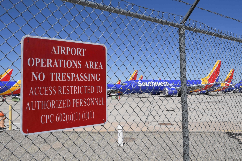 Southwest Airlines Boeing 737 MAX aircraft are parked on the tarmac after being grounded, at the Southern California Logistics Airport in Victorville, California on March 28, 2019. AFP / Mark Ralston 