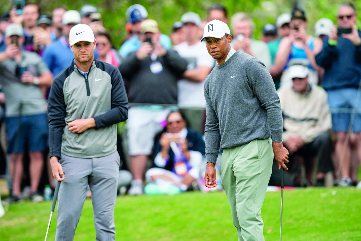  Lucas Bjerregaard and Tiger Woods on the 16th green during the quarterfinal round of the WGC - Dell Technologies Match Play golf tournament at Austin Country Club. Mandatory Credit: Stephen Spillman-USA TODAY Sports
