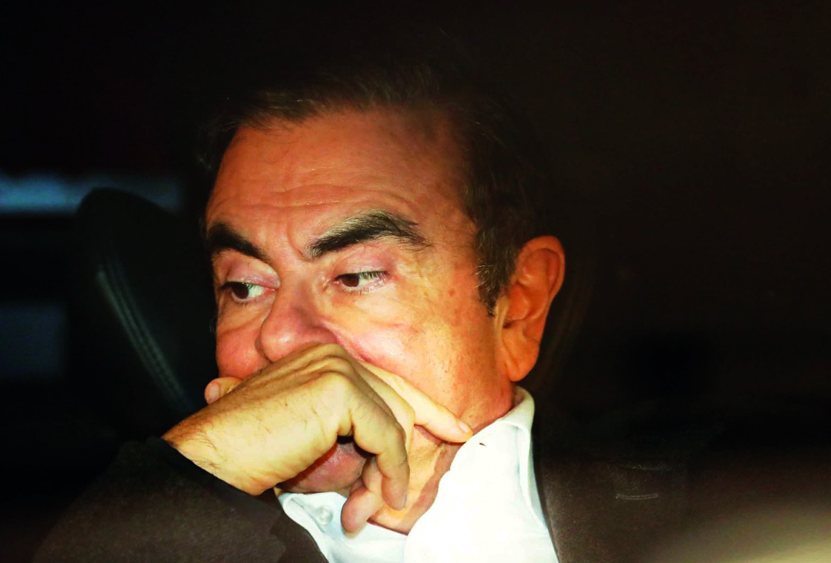 Former Nissan Motor Chairman Carlos Ghosn sits inside a car as he leaves his lawyer's office after being released on bail from Tokyo Detention House, in Tokyo, Japan, March 6, 2019. Reuters/Issei Kato