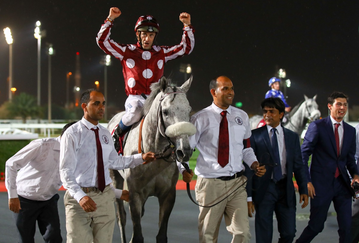 French jockey Olivier Peslier astride Yazeed celebrates after winning the Qatar Gold Sword at the Qatar Racing and Equestrian Club (QREC) yesterday.
