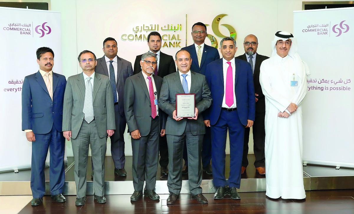 Commercial Bank Group CEO Joseph Abraham  and other senior officials of the bank with the award.