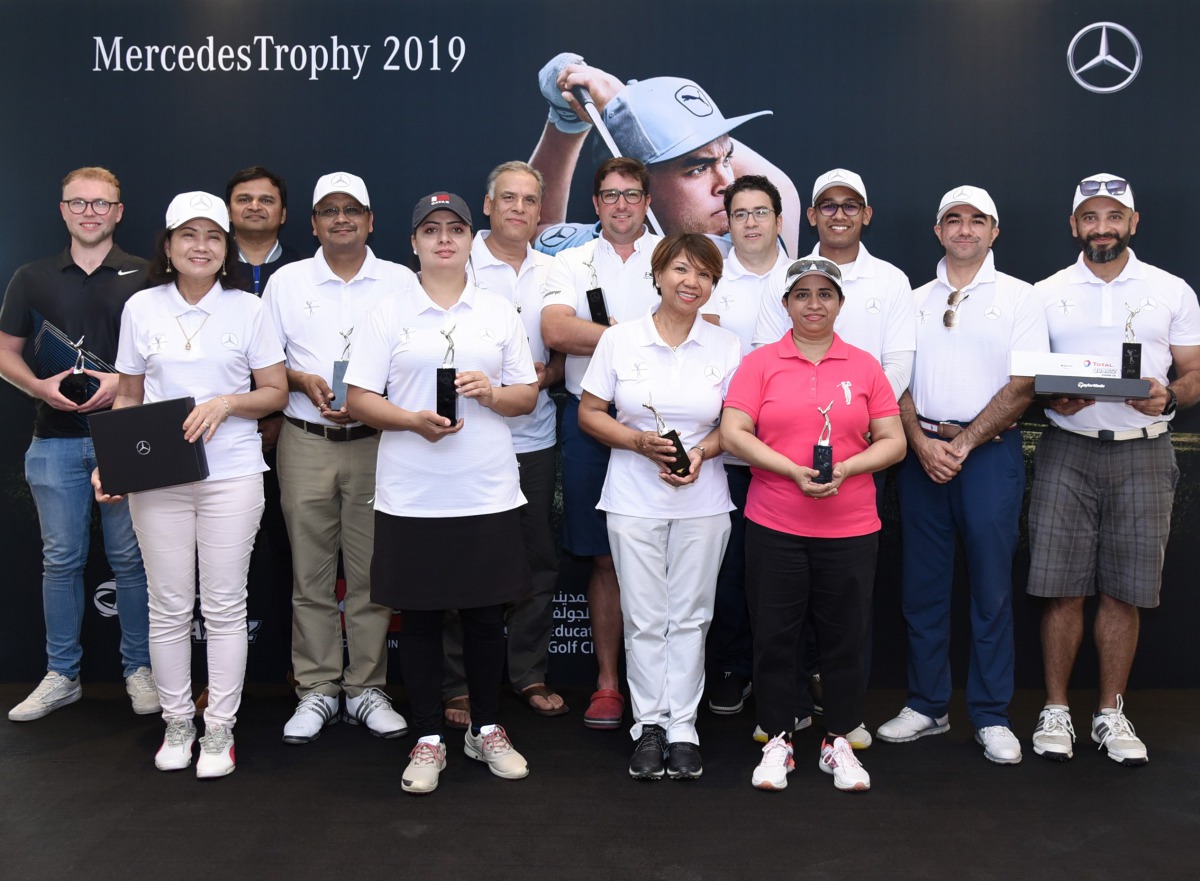 The winning golfers pose for a photograph following the presentation ceremony of the The fourth Mercedes Trophy Golf Tournament, organised by Nasser Bin Khaled Automobiles, at Education City Golf Club.
