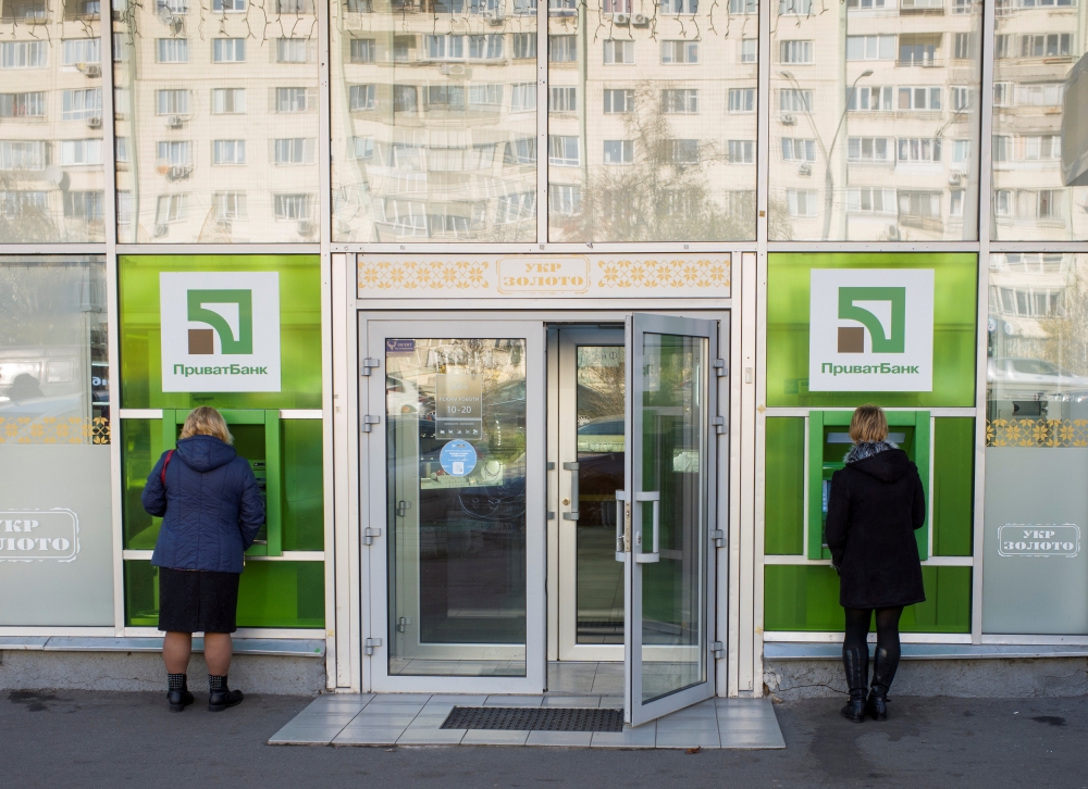 FILE PHOTO: Women use PrivatBank ATM machines in Kiev, Ukraine November 9, 2018. REUTERS/Gleb Garanich