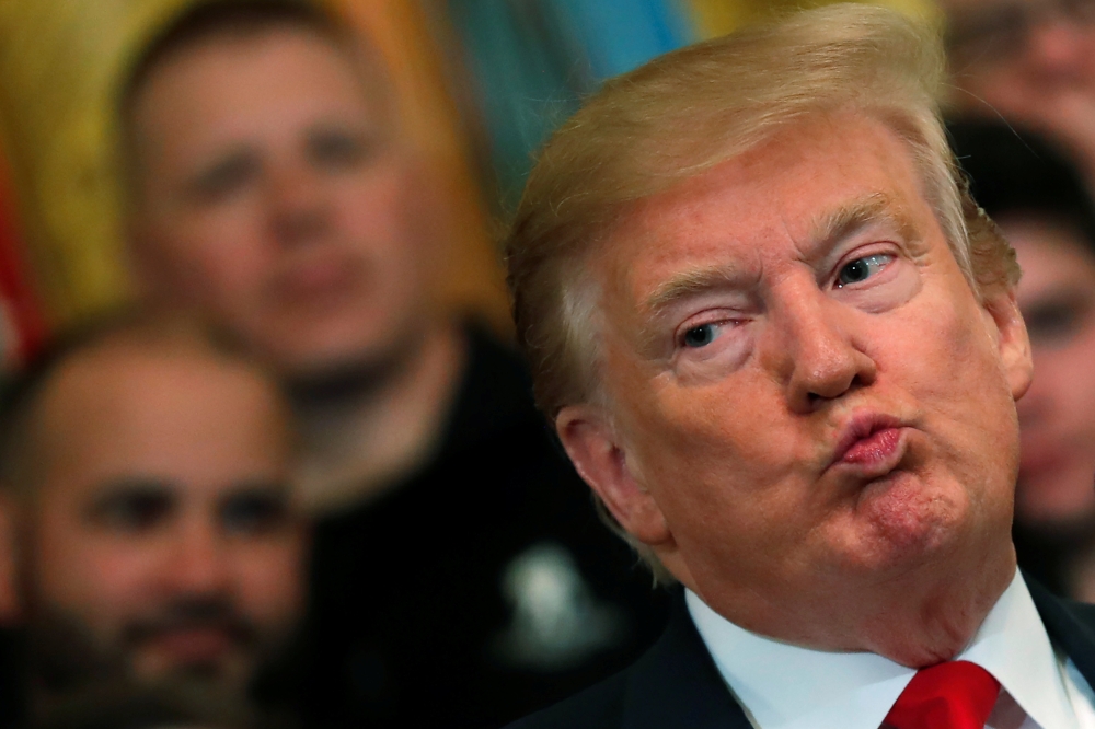 Donald Trump reacts as he speaks at the Wounded Warrior Project Soldier Ride event after the release of Special Counsel Robert Mueller's report, in the East Room of the White House, April 18, 2019. Reuters/Carlos Barria