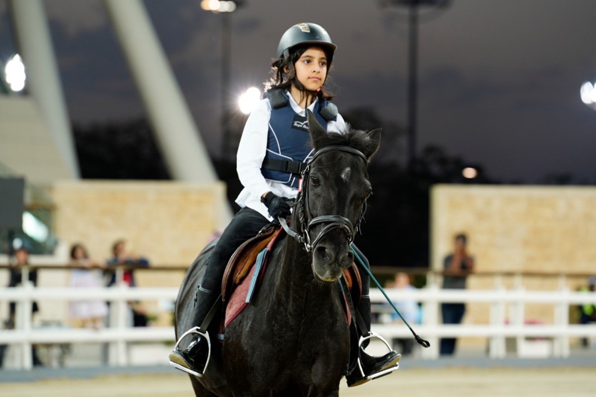 Young riders in action at the Al Shaqab Arena during the Education Department (EED) Show Jumping Competition, yesterday. 