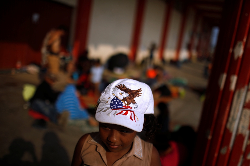 Central American migrants gather in an improvised shelter during a break in their journey towards the United States, in Escuintla, Mexico April 19, 2019. REUTERS/Jose Cabezas