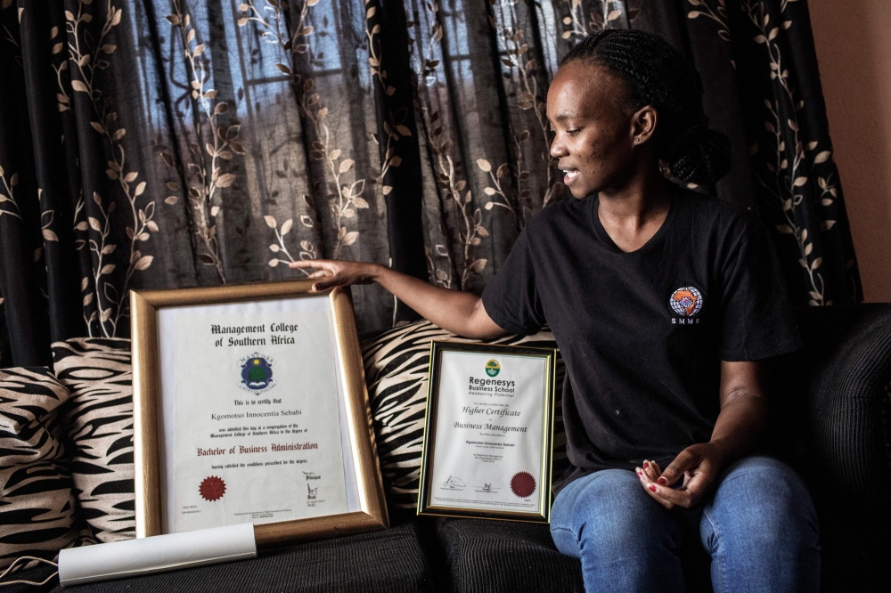 Kgomotso Sebabi, a South African unemployed graduate speaks about the lack of job opportunities at her house in Soweto, Johannesburg on April 3, 2019. AFP / Gianluigi Guercia 