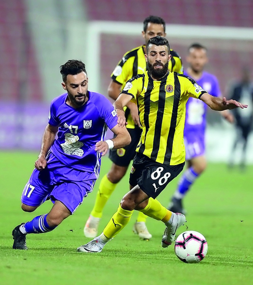 Action from the Amir Cup match between Qatar SC and Muaither at the Grand Hamad Stadium yesterday.