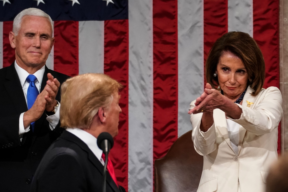 Donald Trump arrives to deliver the State of the Union address alongside Speaker of the House Nancy Pelosi and Vice President Mike Pence at the US Capitol on February 5, 2019. AFP/Doug Mills