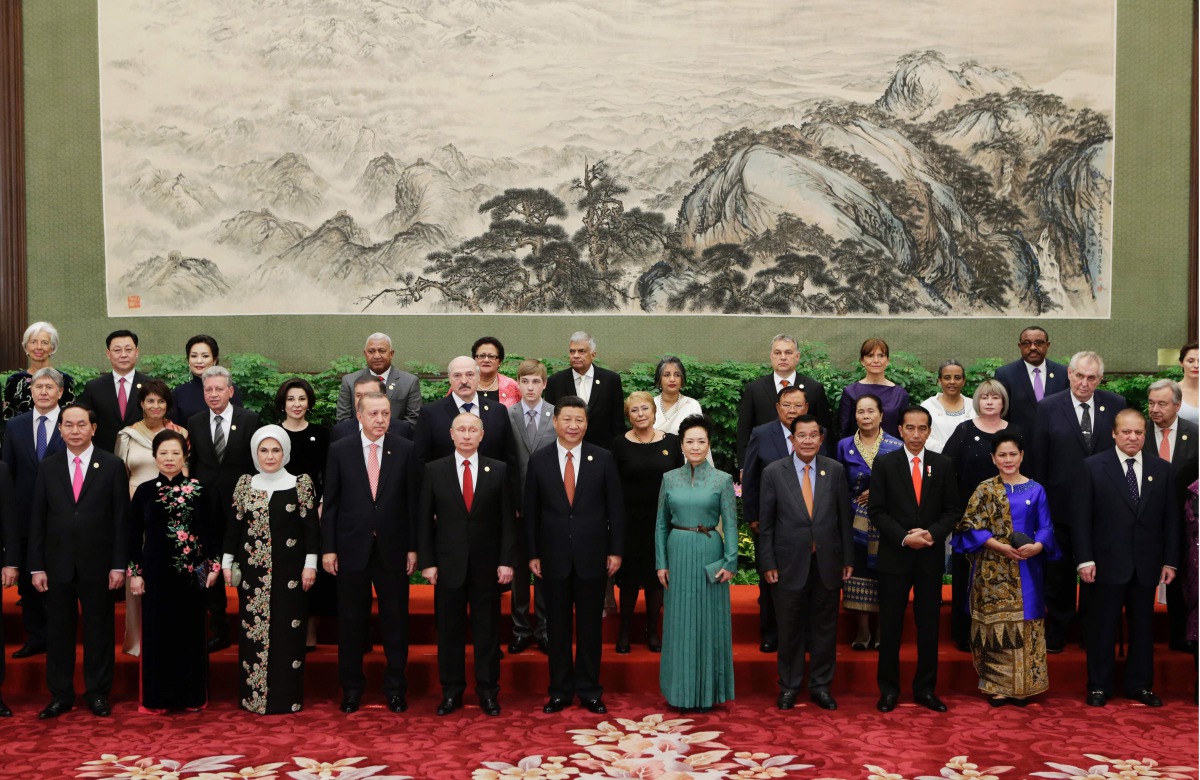 Chinese President Xi Jinping poses for a group photo with other delegates and guests at the welcoming banquet for the Belt and Road Forum in Beijing on May 14, 2017. AFP/Jason Lee
