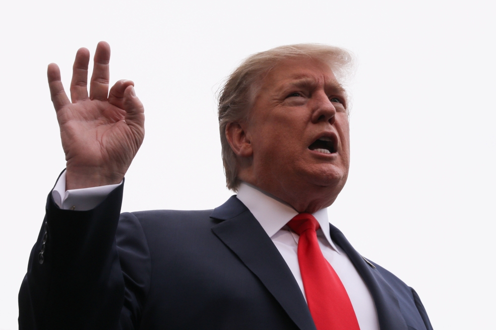 U.S. President Donald Trump talks to reporters as he departs for travel to Indianapolis, Indiana from the White House in Washington, U.S., April 26, 2019. REUTERS/Jonathan Ernst