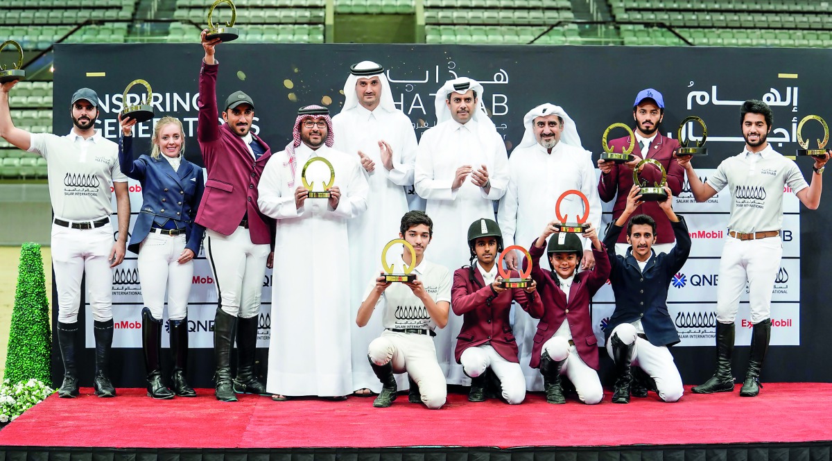 The champion riders of the second edition of the Hathab Equestrian Tour pose for a photograph with Hamad Abdulrahman Al Attiyah, President of the Qatari and Asian Equestrian Federations, and QEF and Al Shaqab officials yestertday.