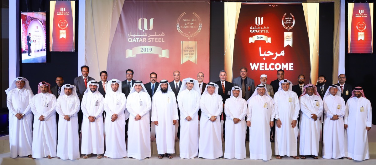 Senior management of Qatar Steel with the long -serving employees.