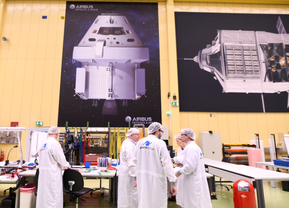 Employees chat at a production line of Airbus' European Service Module (ESM), which is delivered for NASA's Orion Spaceship, at the Airbus plant in Bremen, Germany, February 19, 2019. REUTERS/Fabian Bimmer