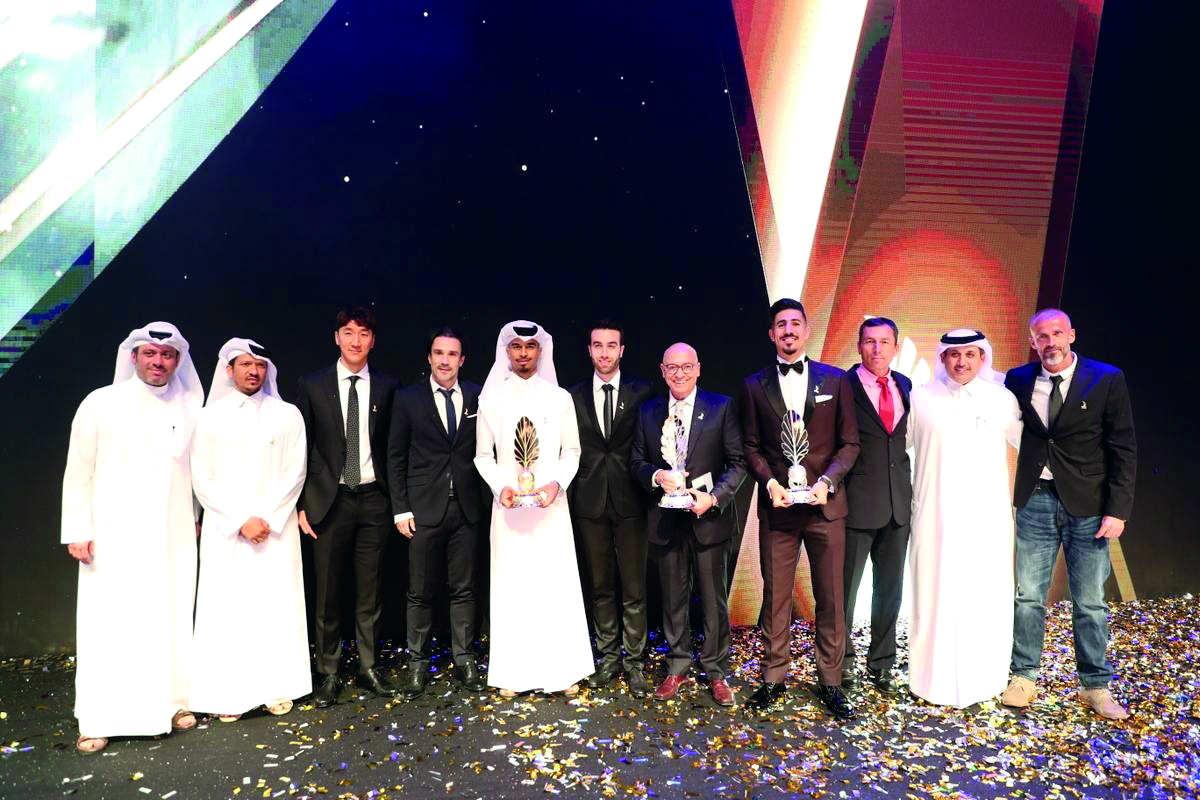 The 2018-19 Qatar Football Association Award winners pose for a photograph at the Qatar National Convention Centre Theatre in Doha’s Education City yesterday.  