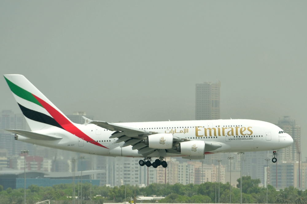 (FILES) In this file photo taken on September 14, 2017 an Airbus A380 of Emirates Airlines lands at the tarmac at Dubai's International Airport. AFP / GIUSEPPE CACACE