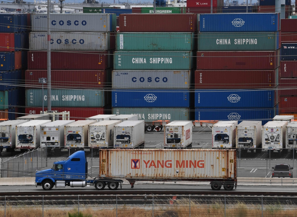 FILE PHOTO: Unloaded containers from Asia are seen at the main port terminal in Long Beach, California on May 10, 2019.  AFP / Mark RALSTON
