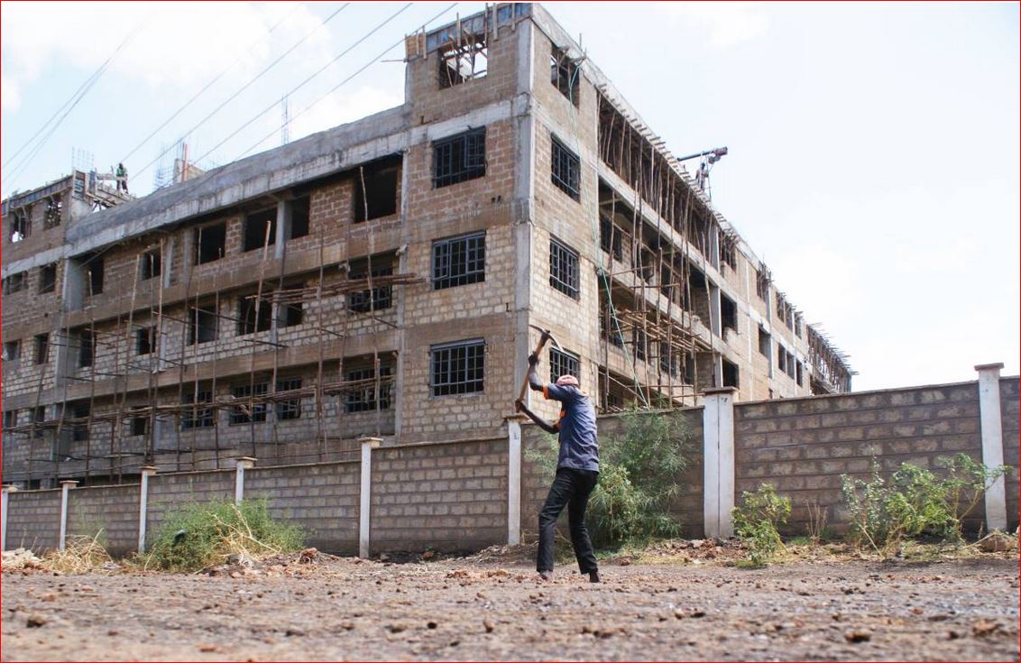 A worker constructing a road in Isiolo town, northern Kenya, March 23, 2019. Thomson Reuters Foundation/Kagondu Njagi