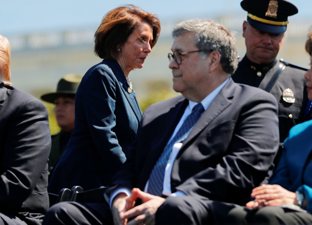 Speaker of the House Nancy Pelosi walks behind Attorney General William Barr as they both attend the 38th Annual National Peace Officers Memorial Service on Capitol Hill, May 15, 2019. Reuters/Carlos Barria