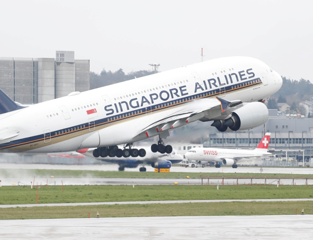 FILE PHOTO: An Airbus A380-800 aircraft of Singapore Airlines takes off from Zurich airport, April 9, 2019. REUTERS/Arnd Wiegmann