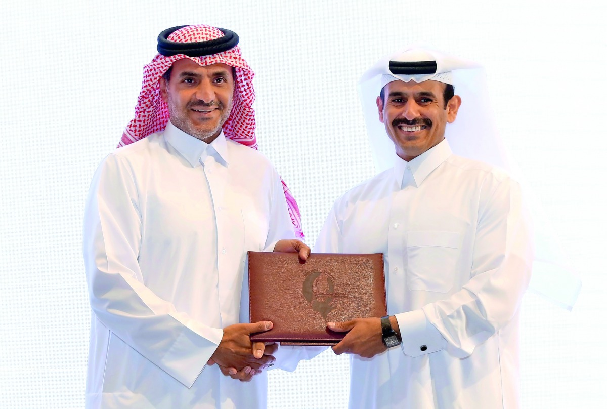 H E Saad bin Sherida Al Kaabi (right), the Minister of State for Energy Affairs, the President & CEO of QP, presents the Qatarization Certificate to Sheikh Khalid bin Khalifa Al Thani, CEO of Qatargas.