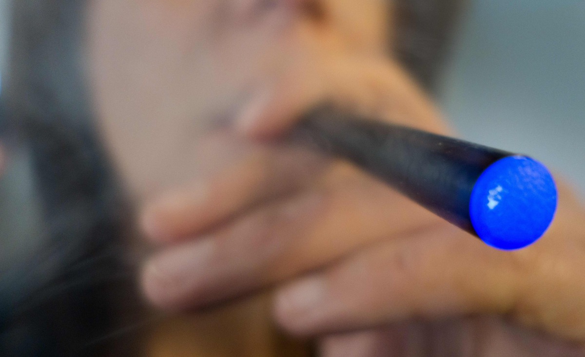 File photo of a woman smoking e-cigarette in Washington DC. AFP/Paul J Richards