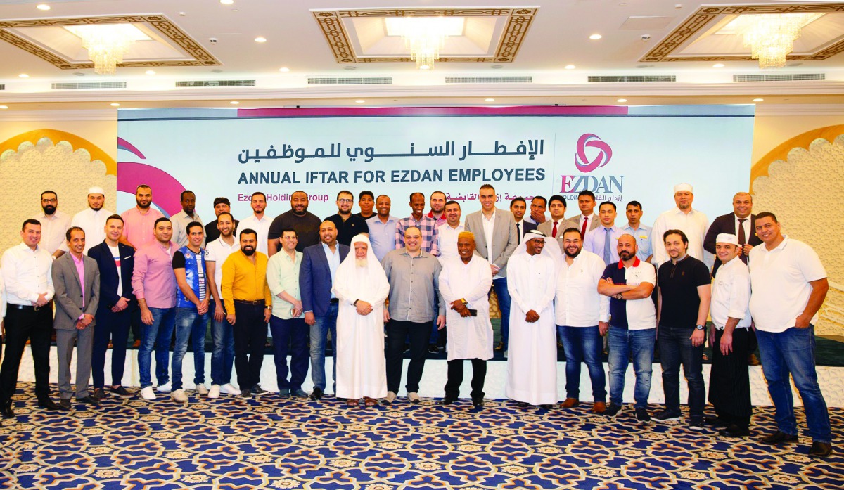 Ezdan Holding Group employees pose for a group photo at the annual Iftar event. 