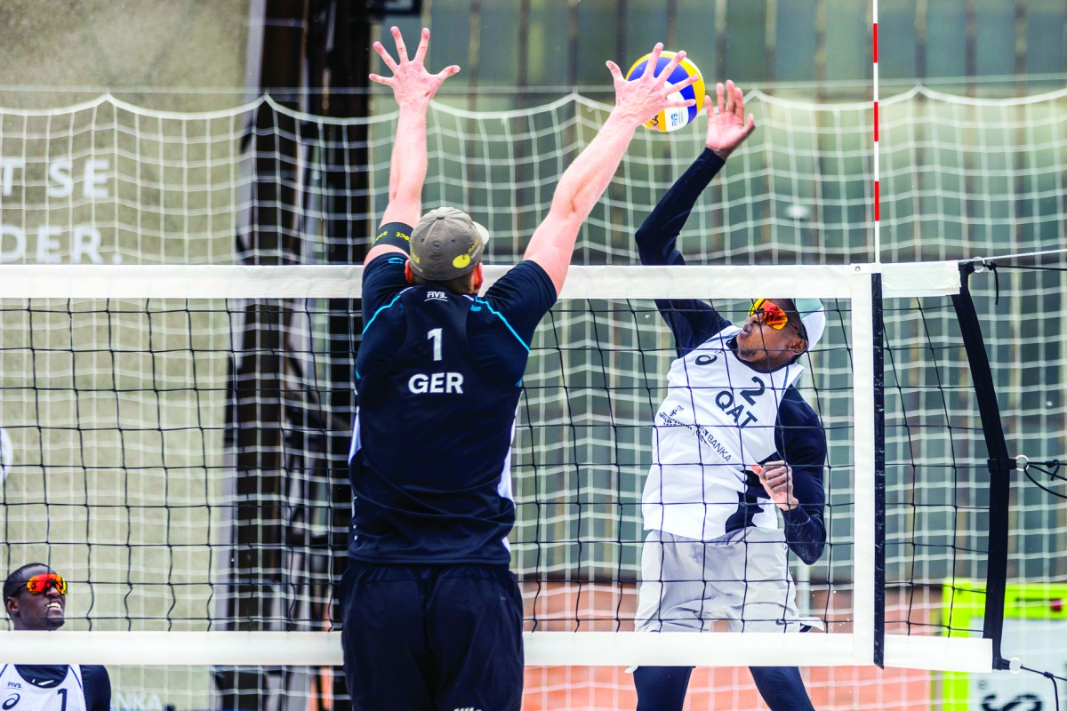 Qatar’s Ahmed Tijan (right) in action against  Germany’s Nils Ehlers during their opening match of the Pool D in the J&T Banka Ostrava Beach Open 2019 in Ostrava, Czech Republic, yesterday.
