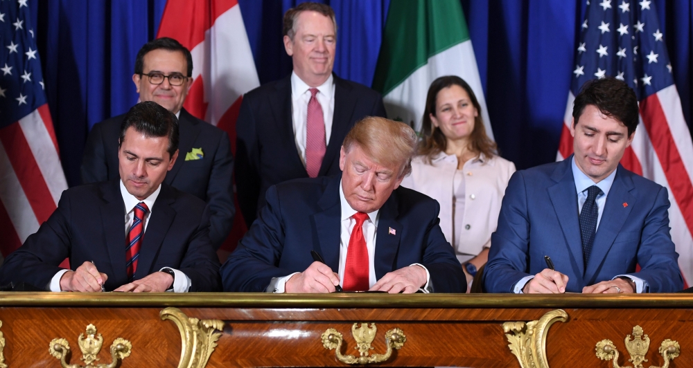 FILE PHOTO: Mexico President Enrique Pena Nieto, US President Donald Trump and Canadian Prime Minister Justin Trudeau sign a new free trade agreement in Buenos Aires on November 30, 2018. AFP / Saul Loeb