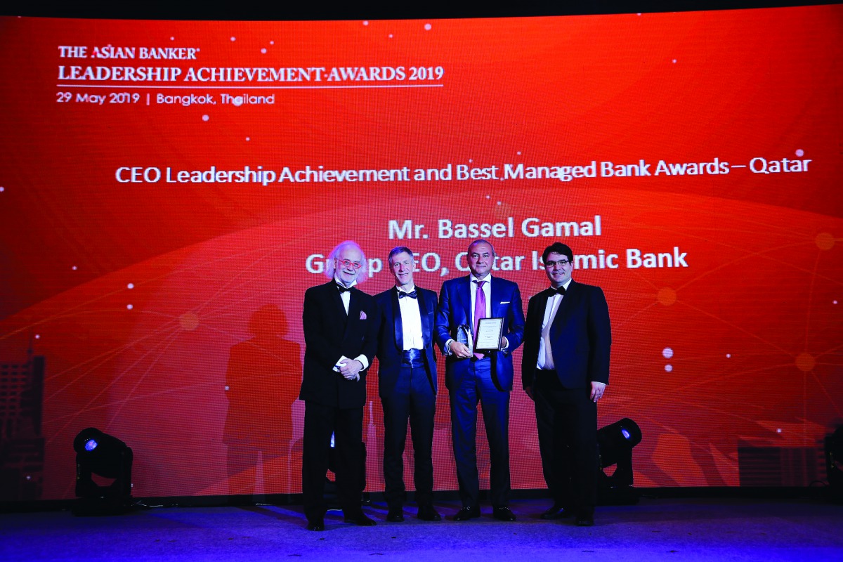 Bassel Gamal, Group CEO of QIB (second right) and other officials during the event.