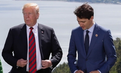 Trudeau's office said he will visit next Thursday. Trump and Trudeau are trying to build momentum to pass the new trade deal that also includes Mexico.