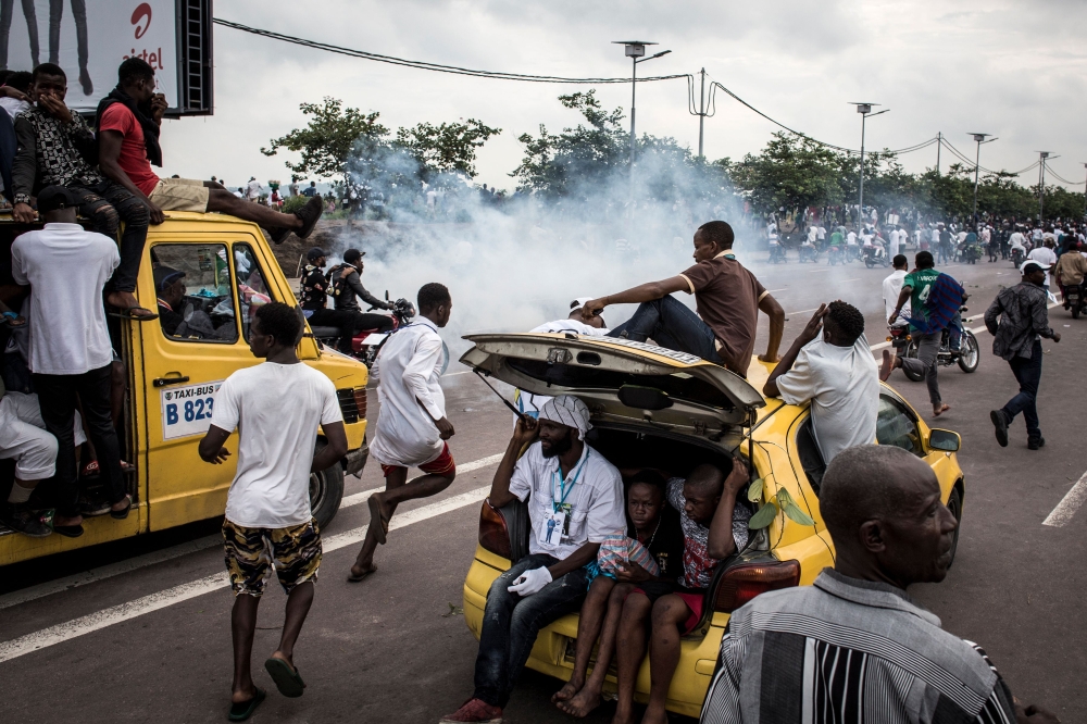 Supporters of Felix Tshisekedi celebrating and cheering in the street of Kinshasa on November 27, 2018. AFP/John Wessels