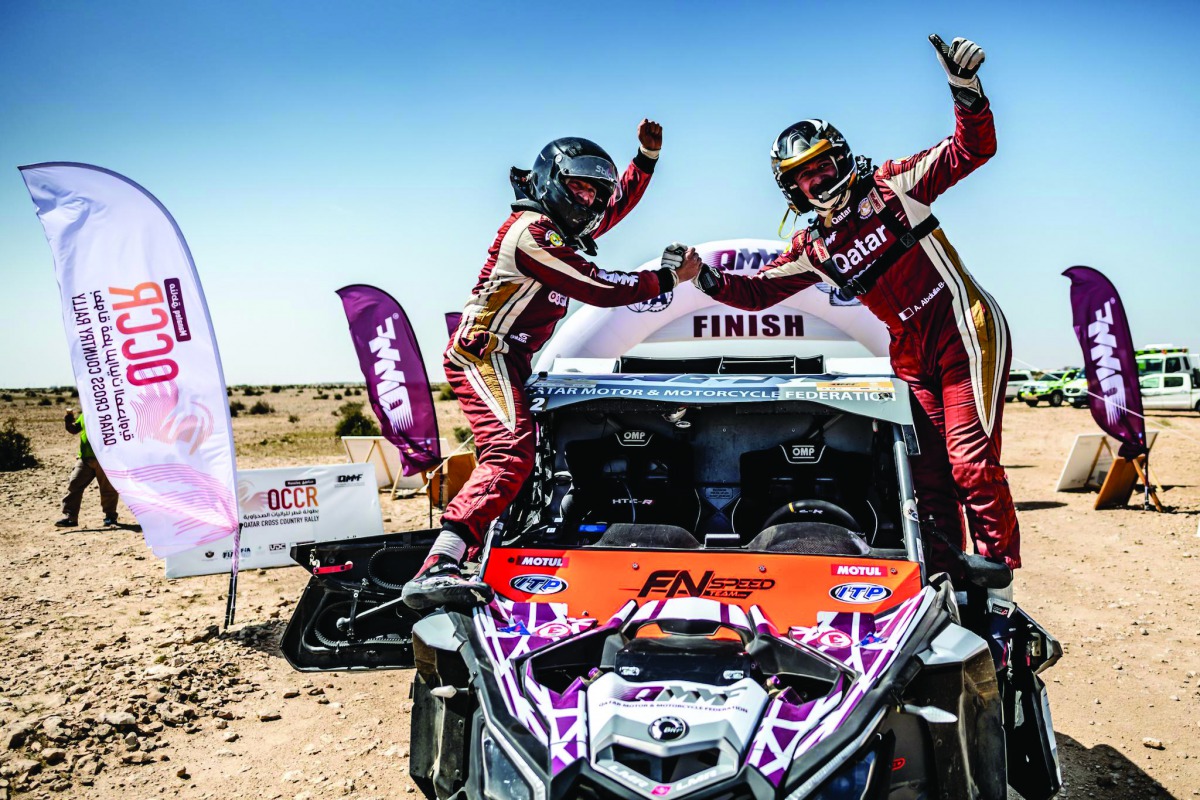 Qaar’s Adel Abdulla and French co-driver Jean-Michel Polato celebrate victory in the Dubai International Baja in this March 2019 file picture.