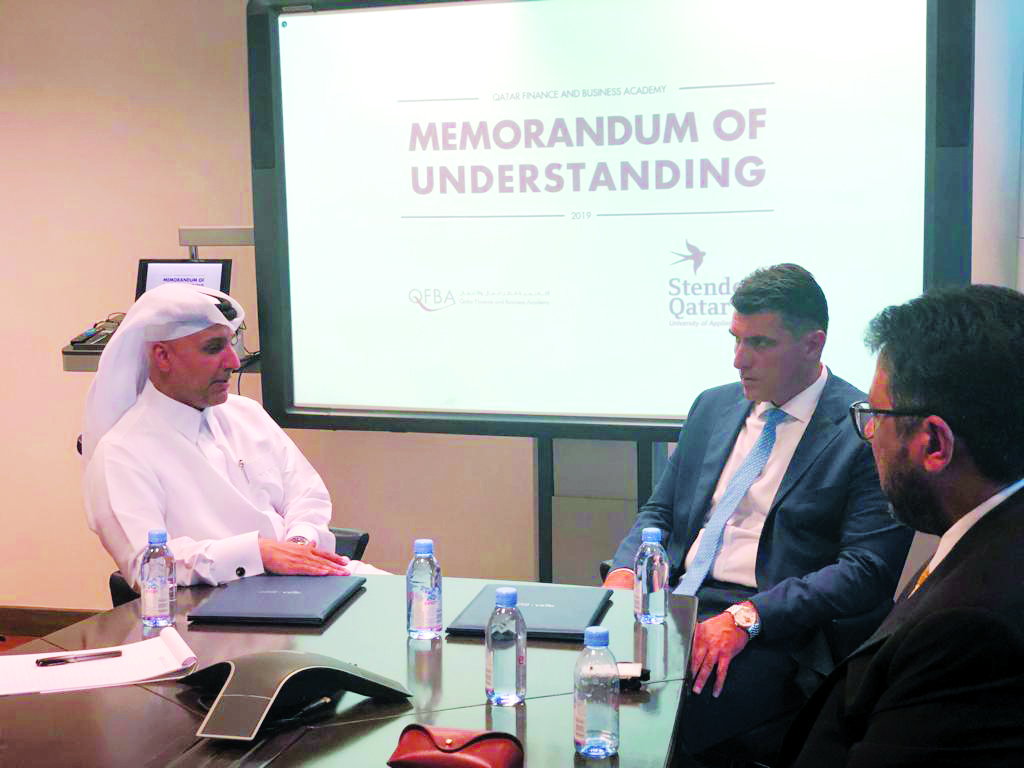 The officials during the MoU signing ceremony.