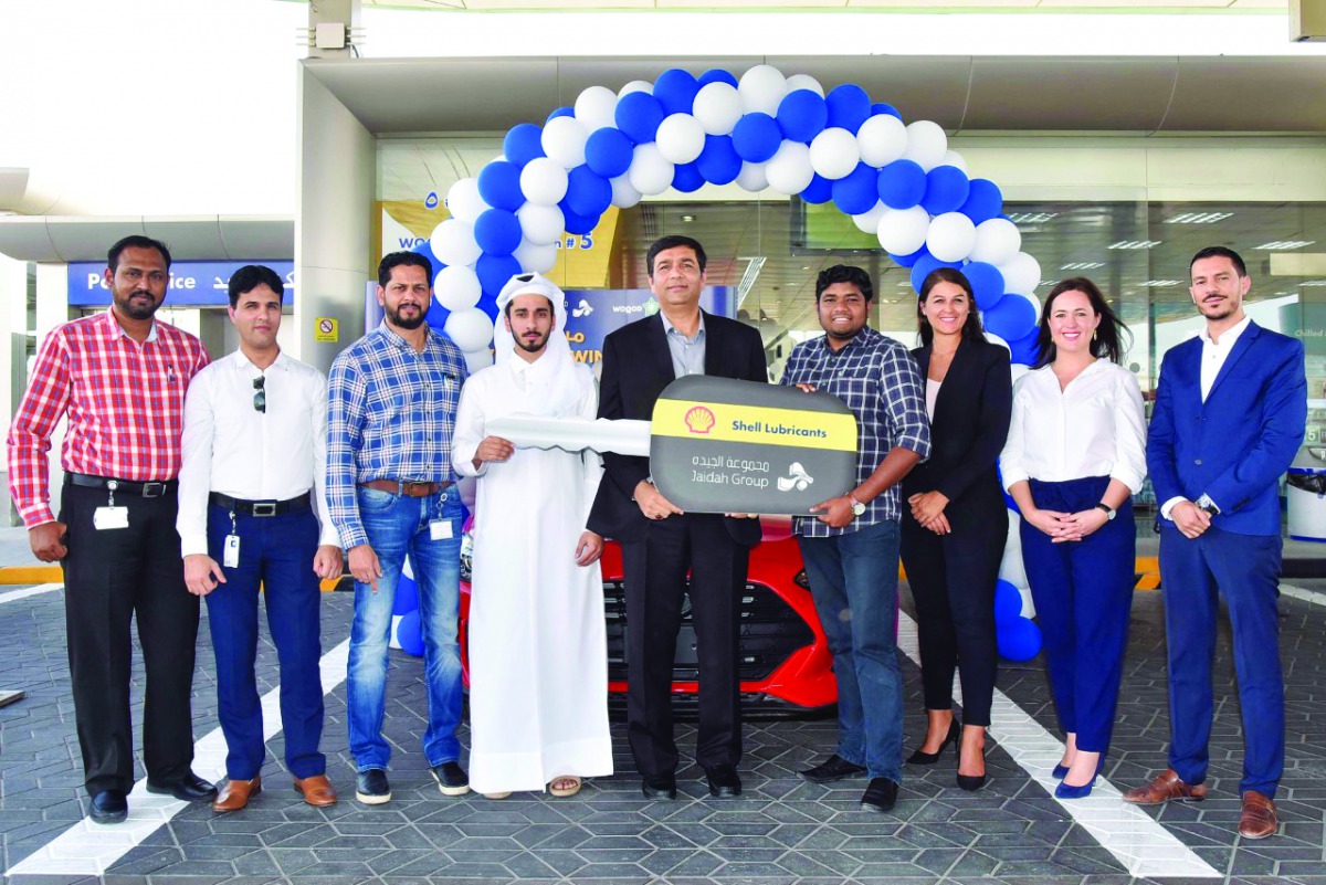 The officials with the winners.