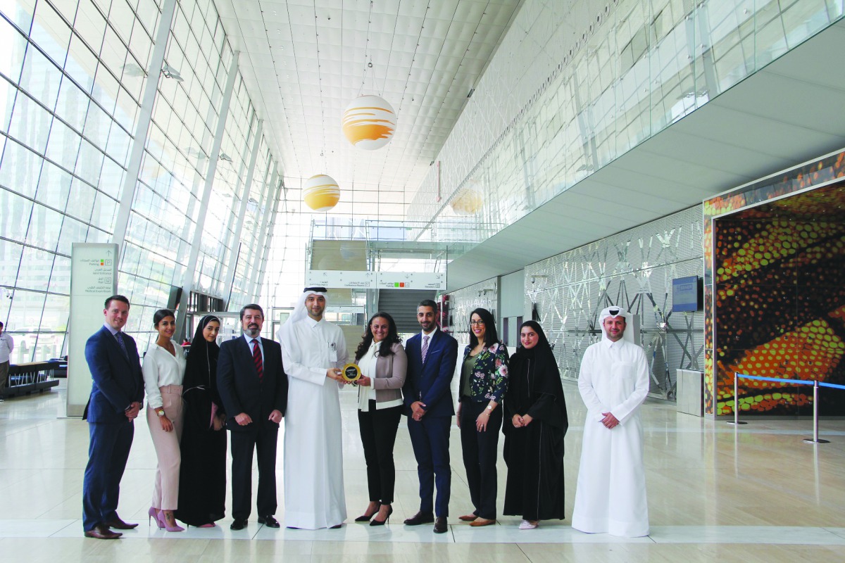 The team members of Qatar National Tourism Council, dmg Events Doha and DECC posing for a picture.