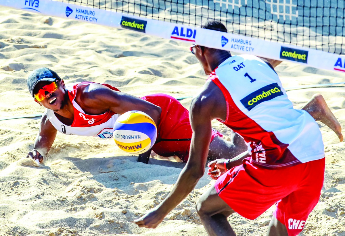 Qatar’s Cherif Younousse and Ahmed Tijan in action during their Pool D clash against Italy’s Enrico Rossi and Adrian Ignacio Carambula on the opening day of the  FIVB Beach Volleyball World Championships in Hamburg, Germany, yesterday.