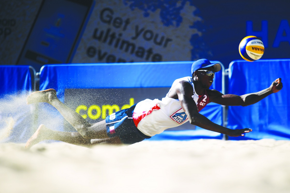Qatar’s Ahmed Tijan in action against Czech Republic’s Ondrej Perusic and David Schweiner during their Pool D match of the FIVB Beach Volleyball World Championships in Hamburg, Germany, yesterday. 