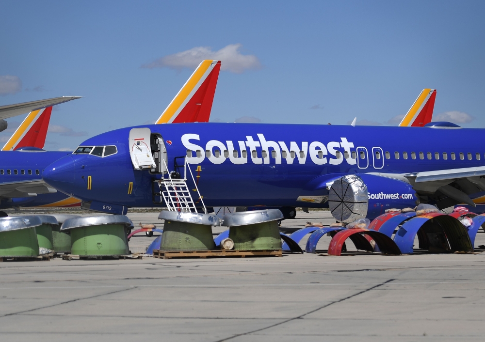 Southwest Airlines' Boeing 737 MAX aircraft are parked on the tarmac after being grounded at the Southern California Logistics Airport in Victorville on March 28, 2019. AFP/Mark Ralston