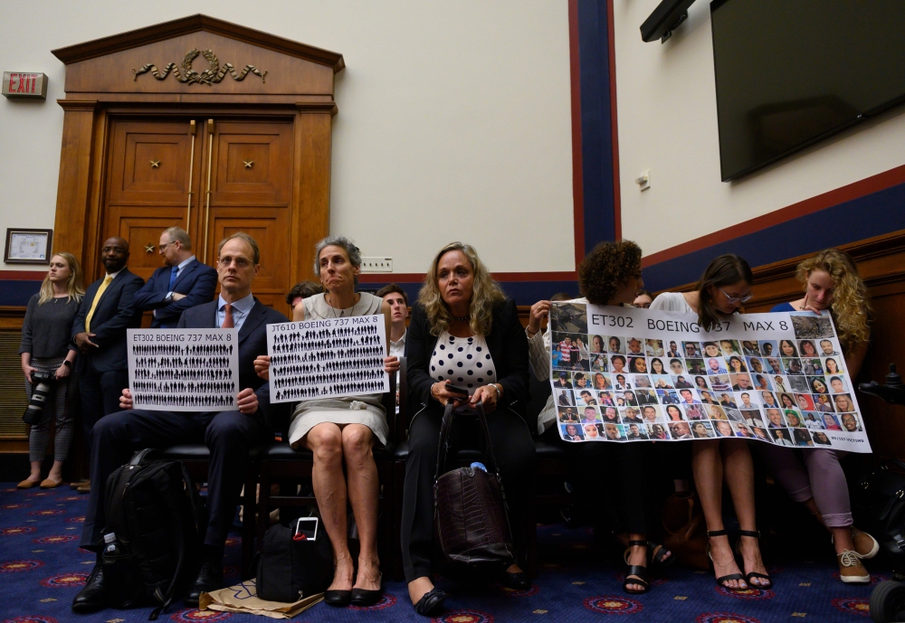 In this file photo taken on June 19, 2019 Nadia Milleron (2ndL) and Michael Stumo (L), the parents of Samya Stumo who was killed in the crash of Ethiopian Airlines Flight 302, look on during an aviation subcommittee hearing on 