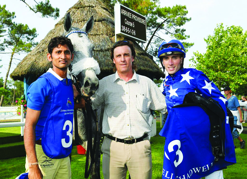 Jockey Julian Smart (right), who guided Ebraz to victory in La Teste, France, poses for a picture with other team members.