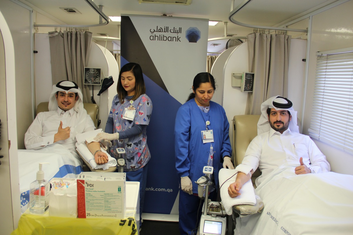 Ahlibank officials at the blood donation event. 